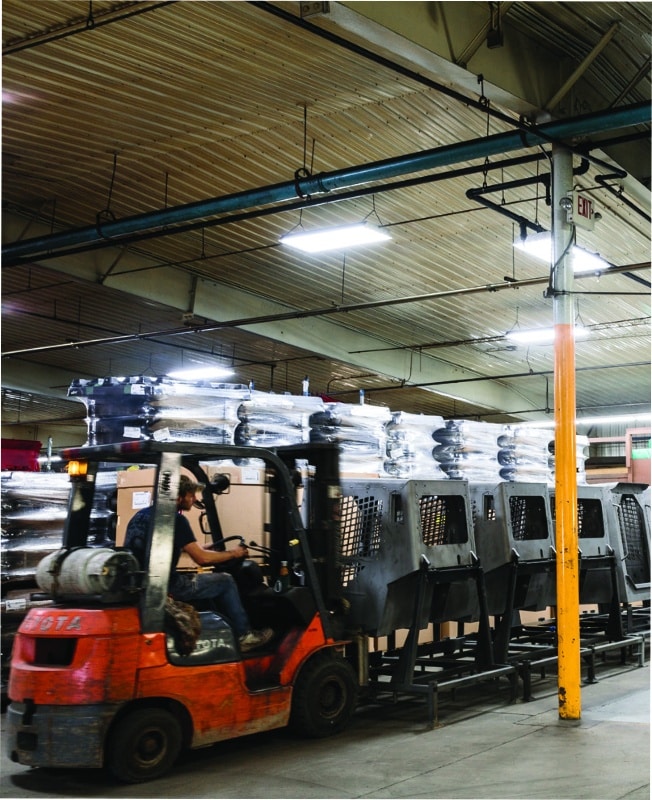 Forklift moving racked parts through the IFS facility